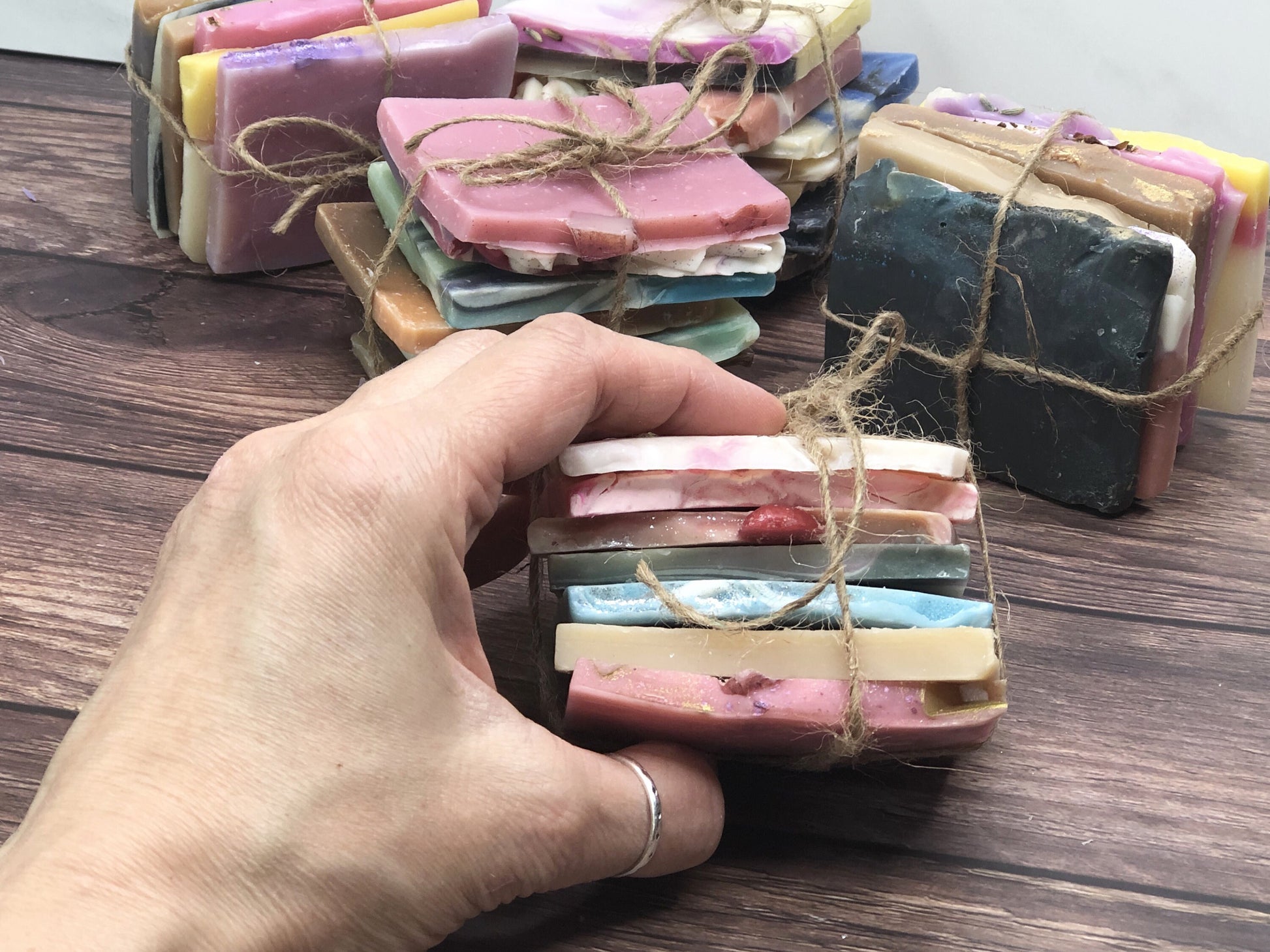 bundle of soap samples in a hand to show size