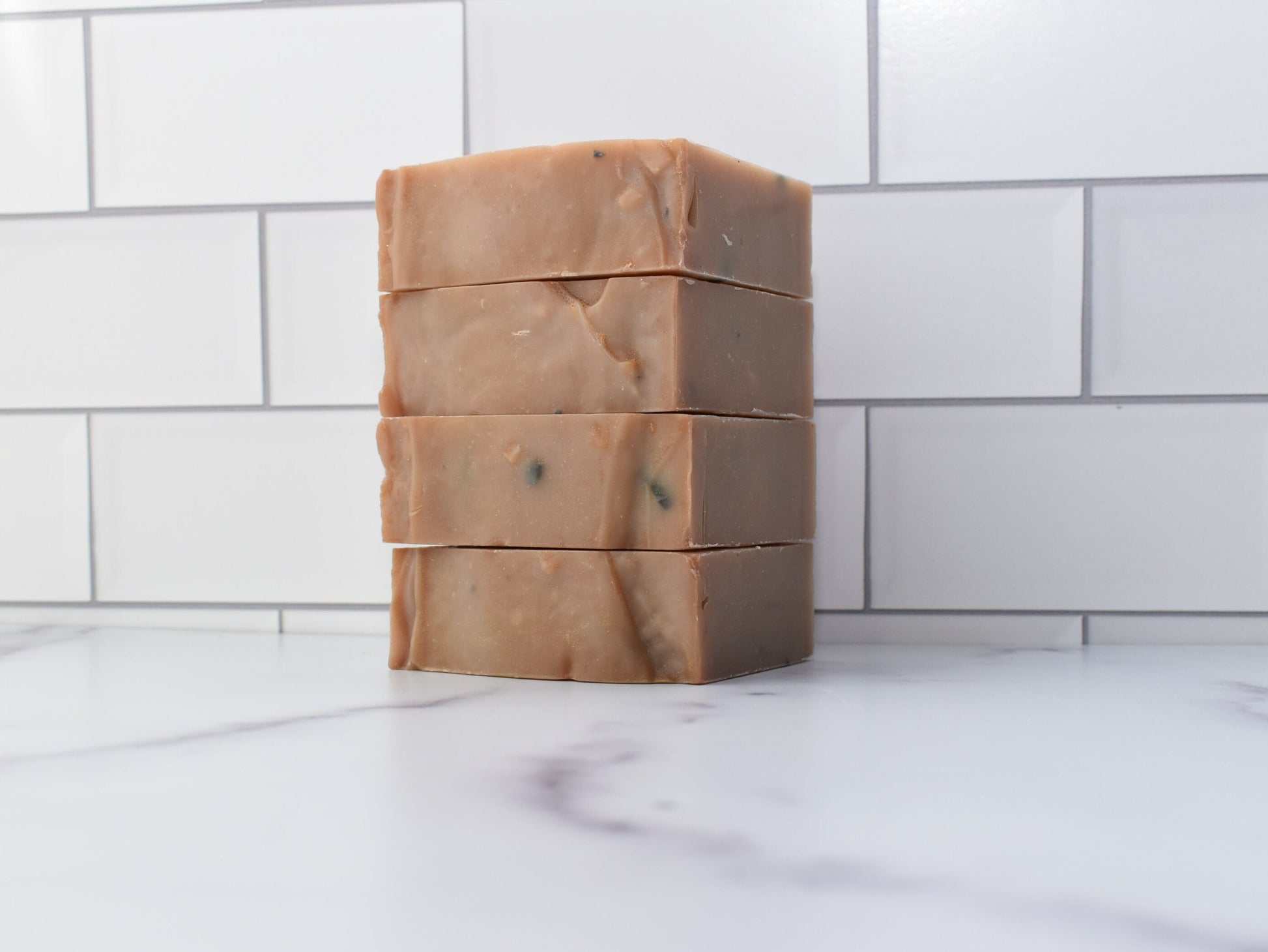 View of a stack of 4 Leather Artisan Soaps